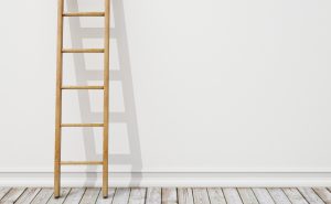 wooden ladder on white wall with vintage wooden floor